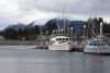 All snug in Wrangell's harbor...beautiful picture with the snow capped mountains in the background!!