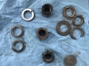 The old nuts and lock nuts......the shipwright used the old ones with no protection......all 3 lock nuts were broken and the nyloc nut in bad shape...the shiny lock nuts are the new ones!!