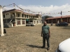 Kaka standing in the middle of the Nepal refugee camp....that is the museum on the left