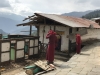 Two monks renovating the sleeping quarters