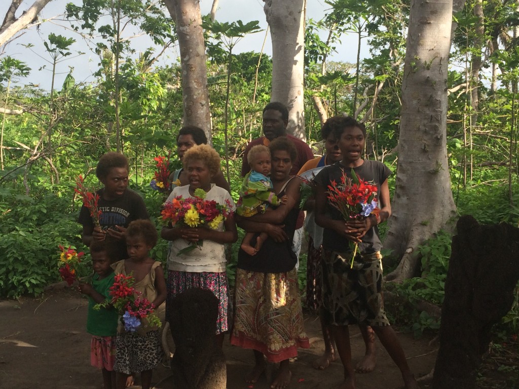 A family sang for us to greet us to Tanna.....most of their homes were destroyed but yet that are giving us flowers as a greeting!!  We had a good discussion with them and they are all safe, have rebuilt their homes and are now eating vegetables from their gardens!!