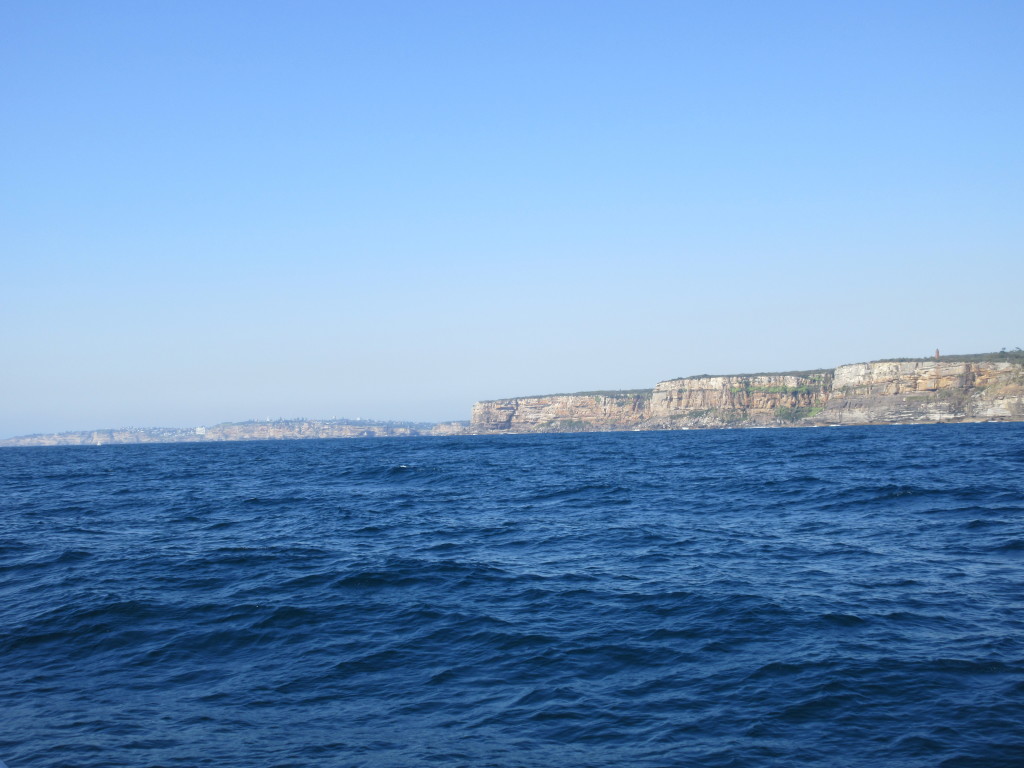 Approaching Sydney Harbor: that is North Head in the foreground and the harbor entrance is just past it!