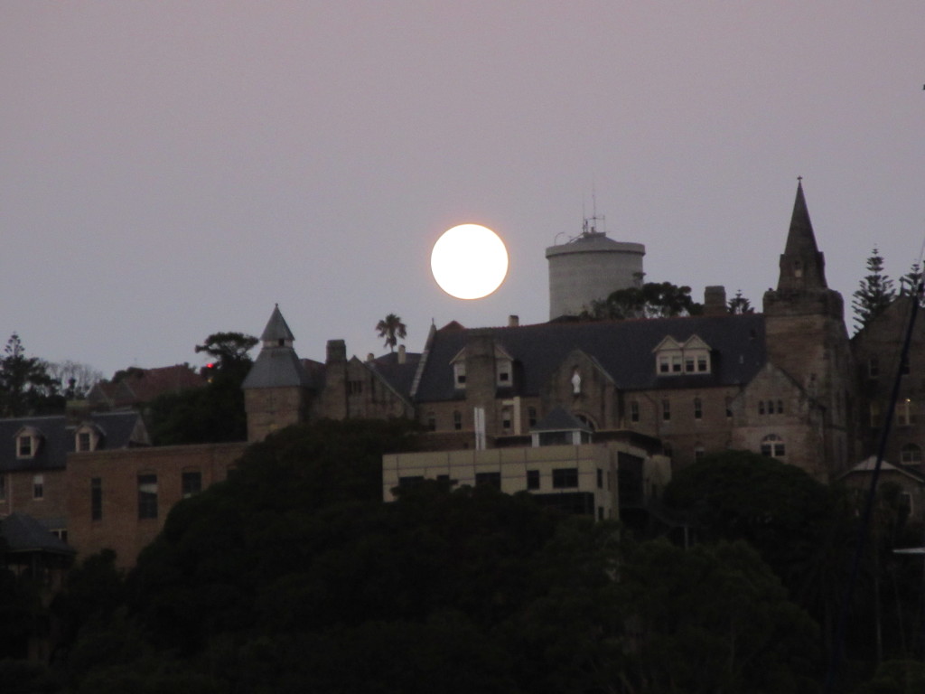 Christmas night moon over an old convent