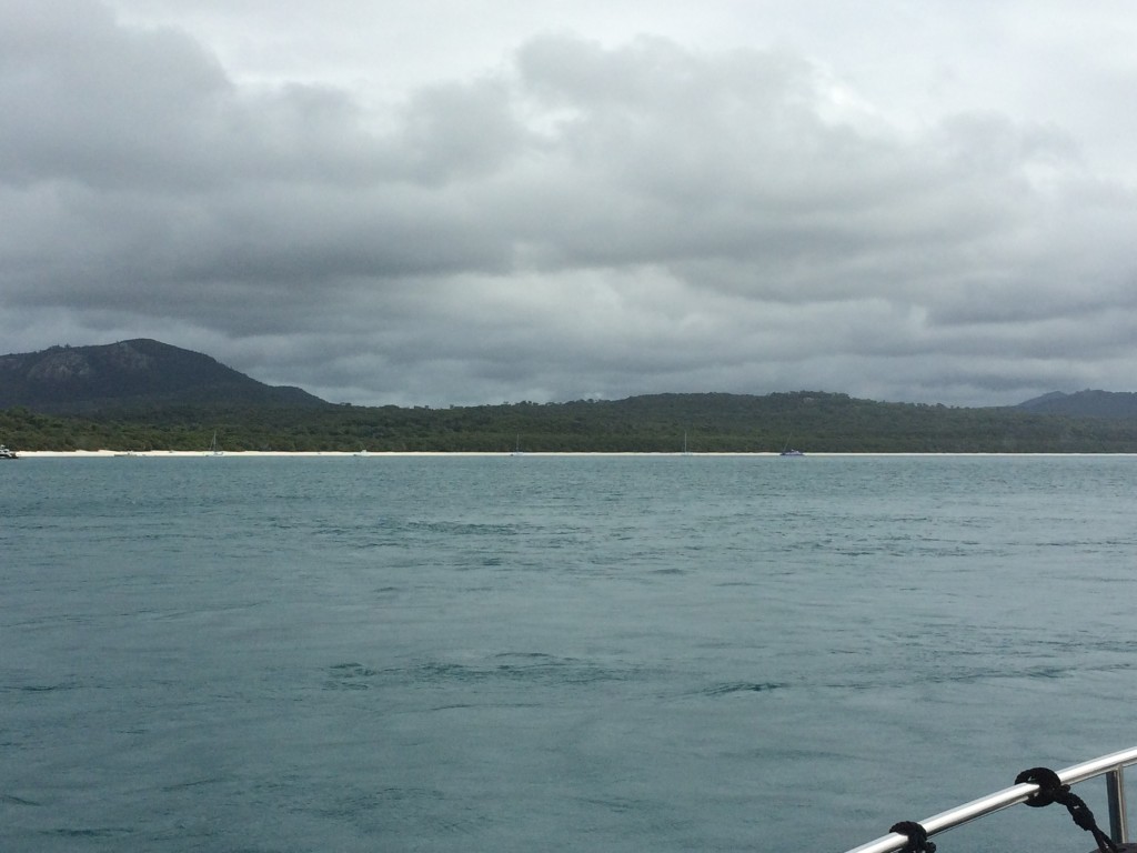 Our first view of the famous Whitehaven beach....note how dark and stormy it is looking!!